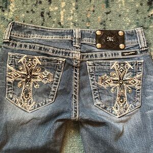 Miss Me bootcut jeans. Cross design on pockets. Size 28